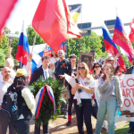 Marcia del Reggimento Immortale a Bologna con partecipanti e gonfalone comunale